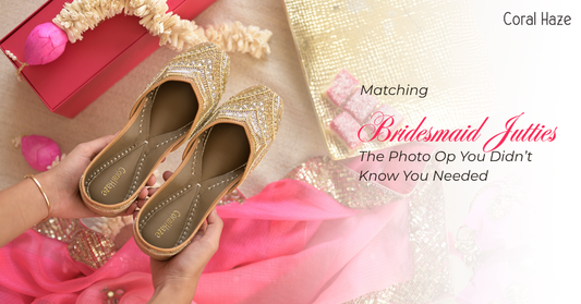 Gold glittery flats held by a hand with a pink and gold decorative background