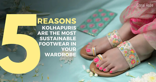 Woman wearing handcrafted floral Kolhapuri sandals with pink nail polish on a pastel background – sustainable Indian footwear by Coral Haze
